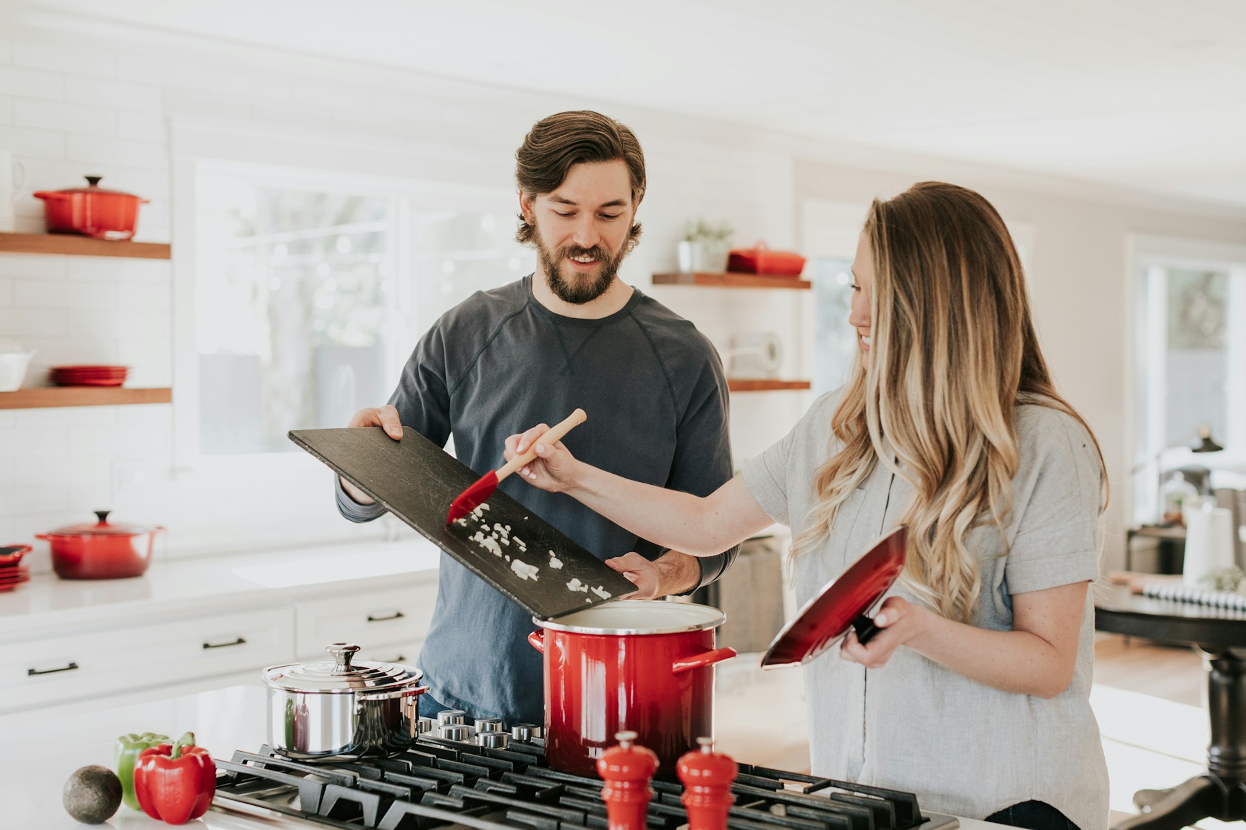 Premium kitchenware arranged on a warm neutral countertop
